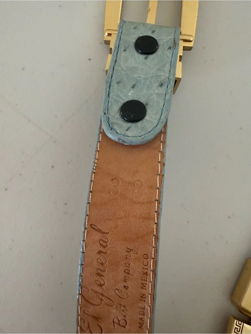 El General Belt Company Blue Genuine Ostrich Leather Gold Medusa Hardware Belt